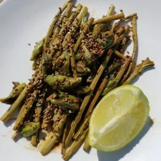Fireweed, sesame seed and lime leaf bud snacklet.

Fireweed, Rosebay willow herb, bomb weed, and poor man's asparagus are some of the common names given to Chamerion Angustifolium. As the last common name implies it does have asparagus over tones and in my opinion tastes better. After picking, slightly bend near the bottom of the shoot or cut off and discard the woody bit as you would with asparagus. The lime leaf buds when young have a wonderful nutty flavour which I add in to many dishes and salads.

Method
I toast the sesame seeds in a dry pan for a few minutes and put to the side.
Add butter to pan, add Fireweed and cook for three minutes then add the leaf buds and cook for a further two minutes.
Then add a squeeze of lime and a dash of soya sauce.
Serve up on a plate sprinkled with the sesame seeds.

A beautiful starter, side dish or snacklet worthy of any gourmet restaurant!  #Forageuk #foraging #Wildfood #foriginginworcestershire #foragingcourses #Wildfoodwalks #plantbased #plantbasedfood #plasticfree #nature #organicfood #pesticidefree #Vegan #meatfree #rewild #Reconnectwithnature #eatgreen #eattheweeds #experiencedays #rosebaywillowherb